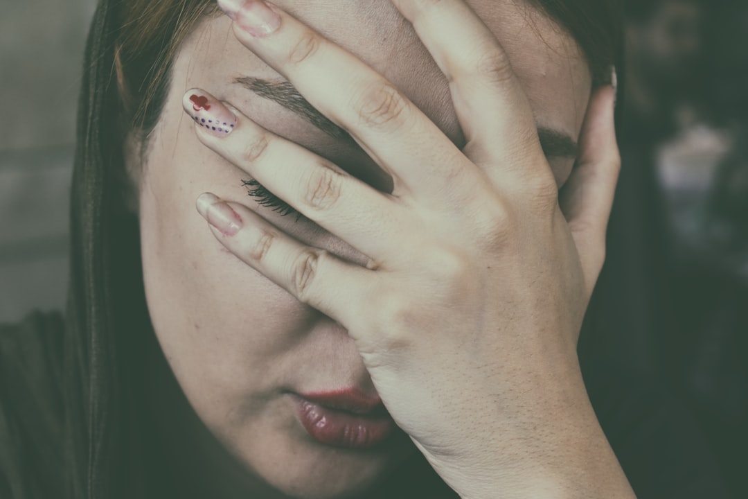 embarrassed_person_covering_face